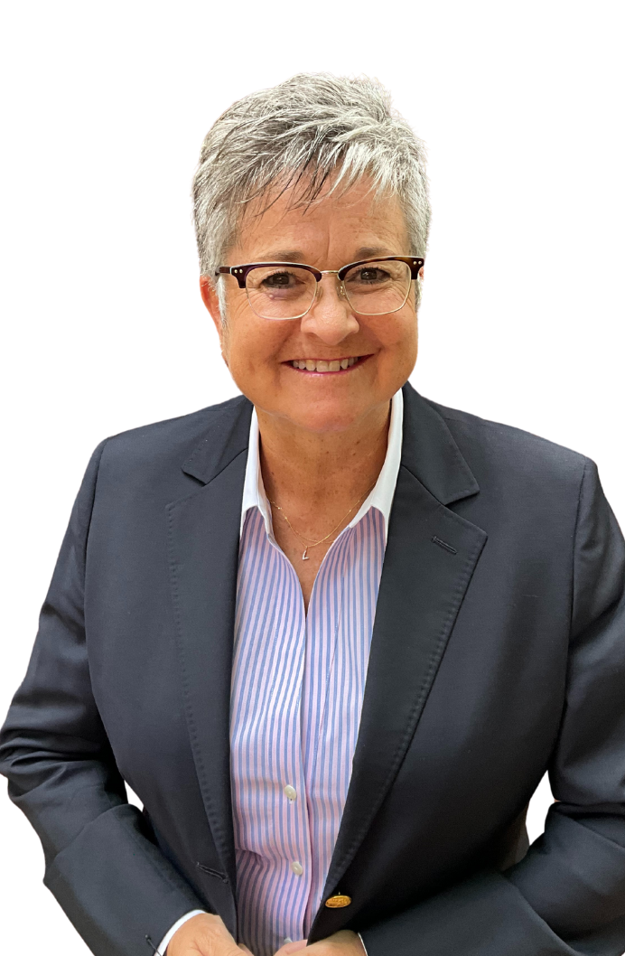 Portrait of Lori Ball, CEO of Astoriom, wearing glasses and a navy blazer over a striped shirt. She is smiling and has short, grey hair, exuding a professional and approachable demeanour.